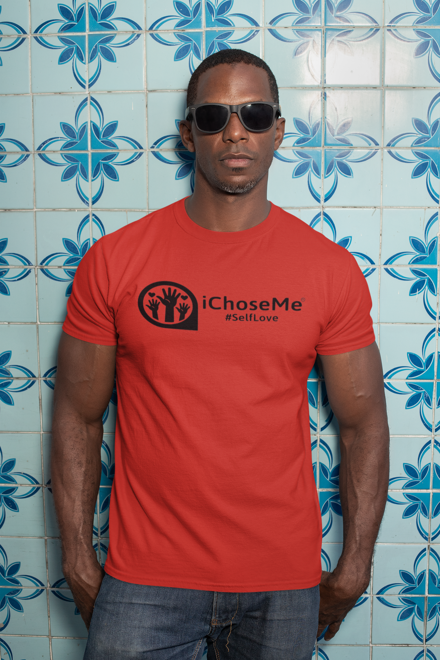 Red iChoseMe #SelfLove T-shirt worn by man with sunglasses against blue patterned tile wall