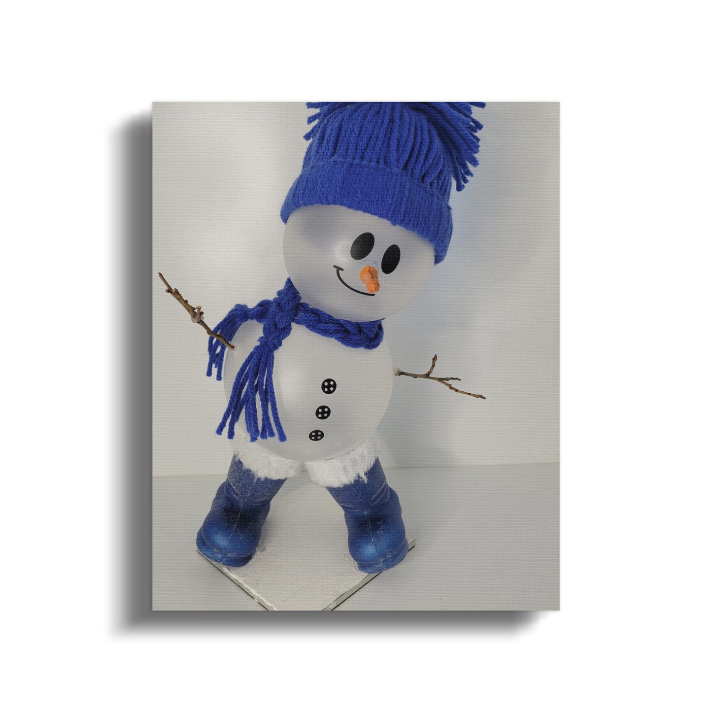 Adorable Snowman Figurine with Blue Winter Accessories
