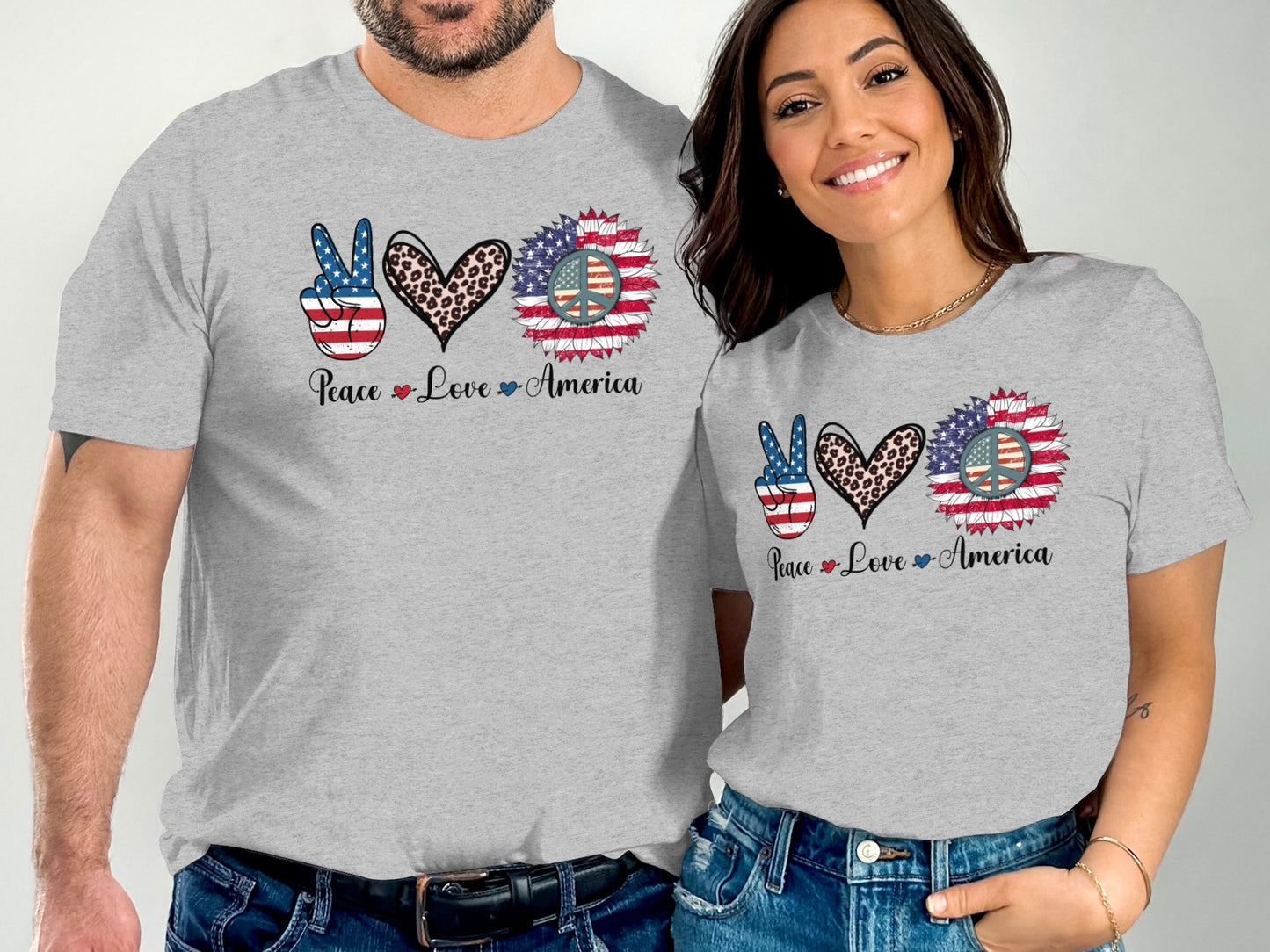 Couple wearing grey t-shirts with "Peace Love America" and patriotic sunflower hearts.
