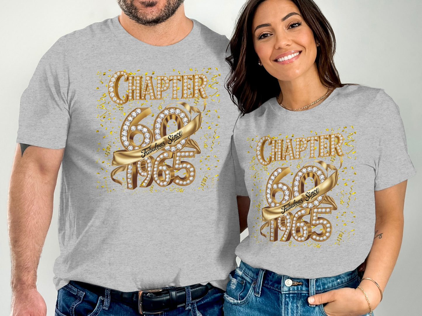 Men and woman wearing gray t-shirts with Chapter 60 Fabulous Since 1965 gold design
