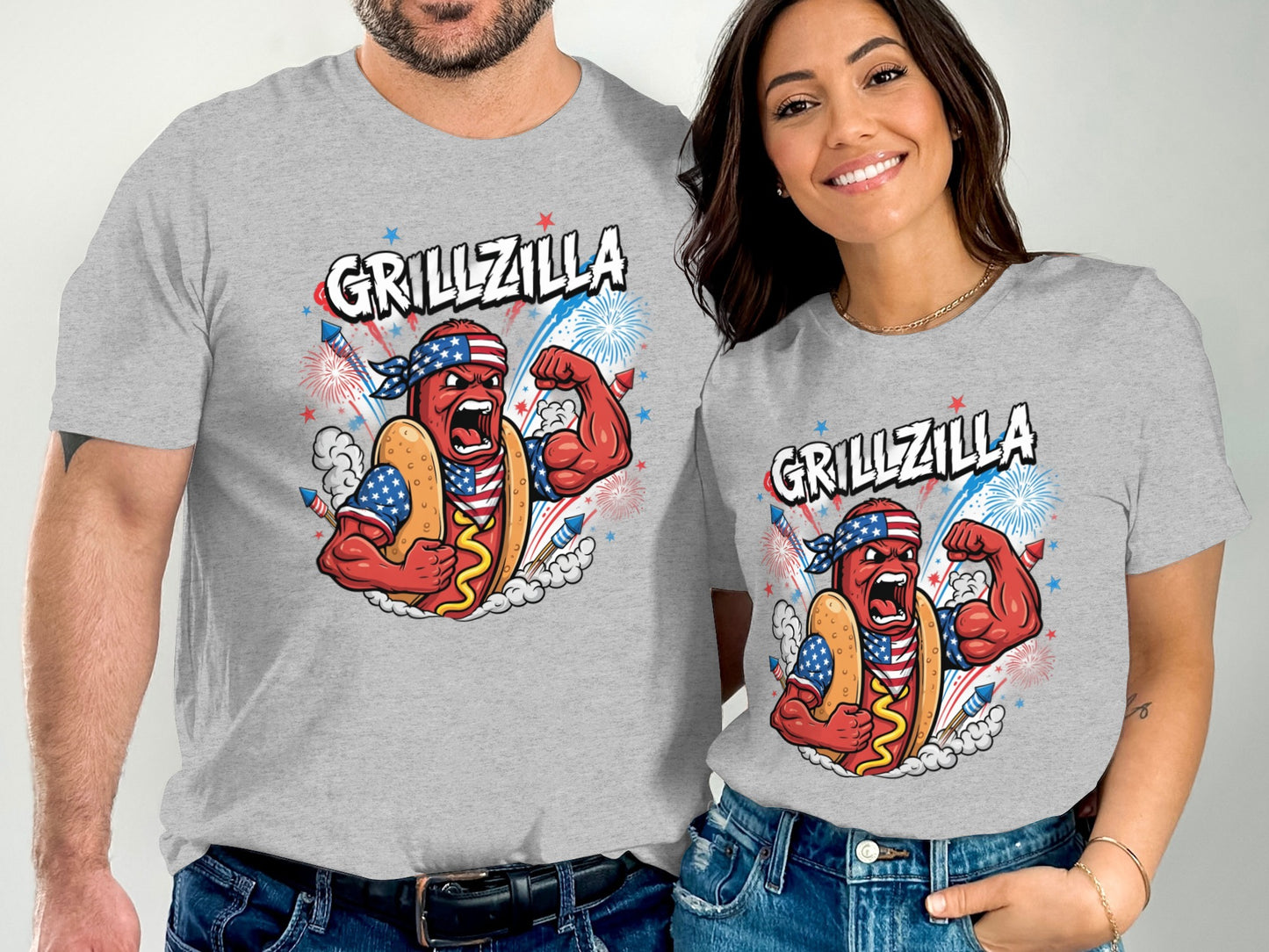 Couple wearing gray t-shirts with a muscular hot dog graphic and "Grillzilla" text.
