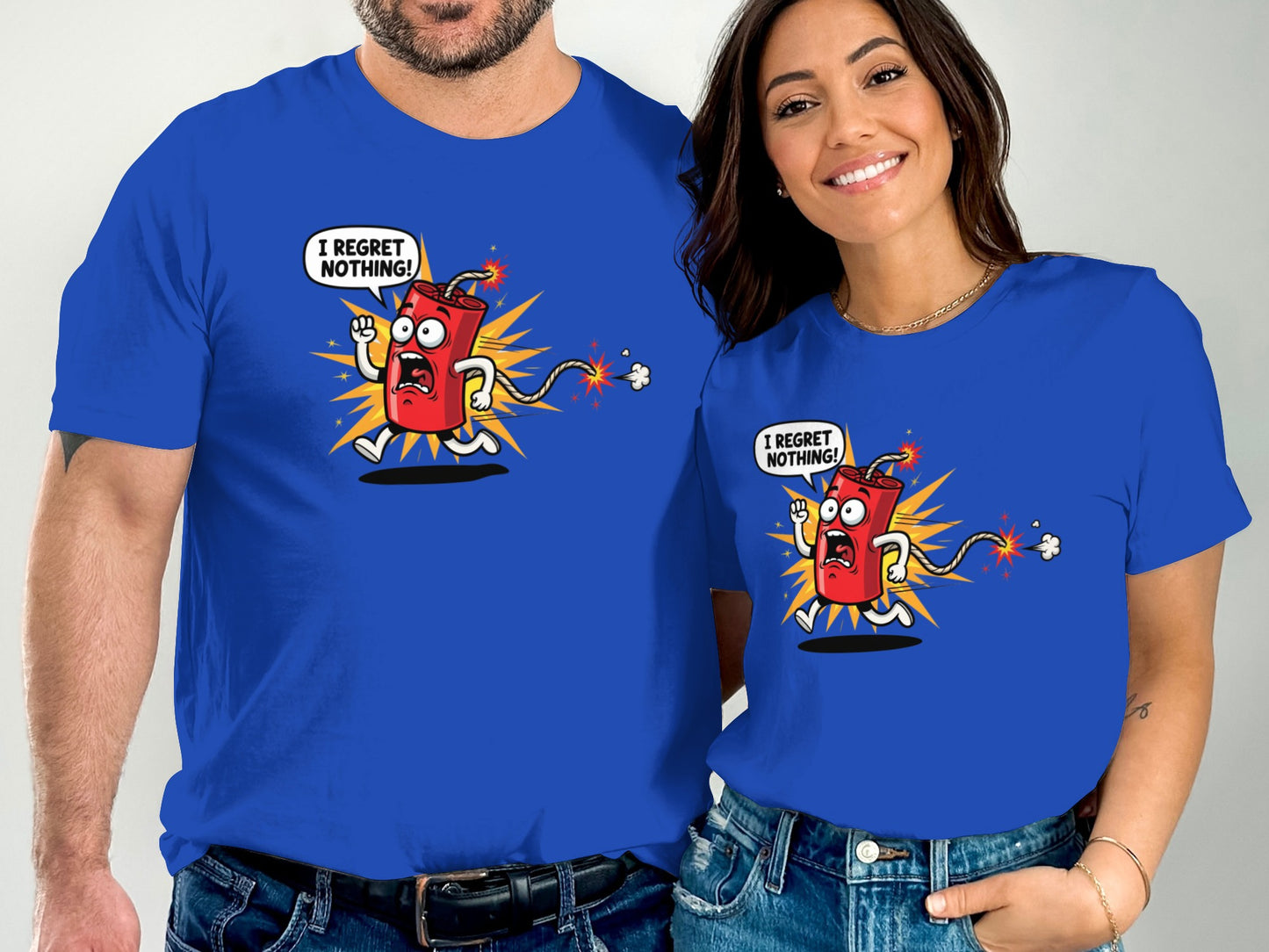 Couple wearing matching blue t-shirts with cartoon bomb saying "I regret nothing!".
