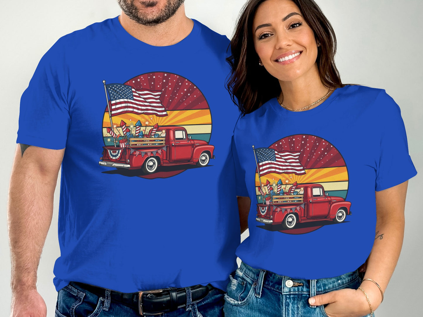 Red truck with American flag and fireworks, on blue t-shirts.