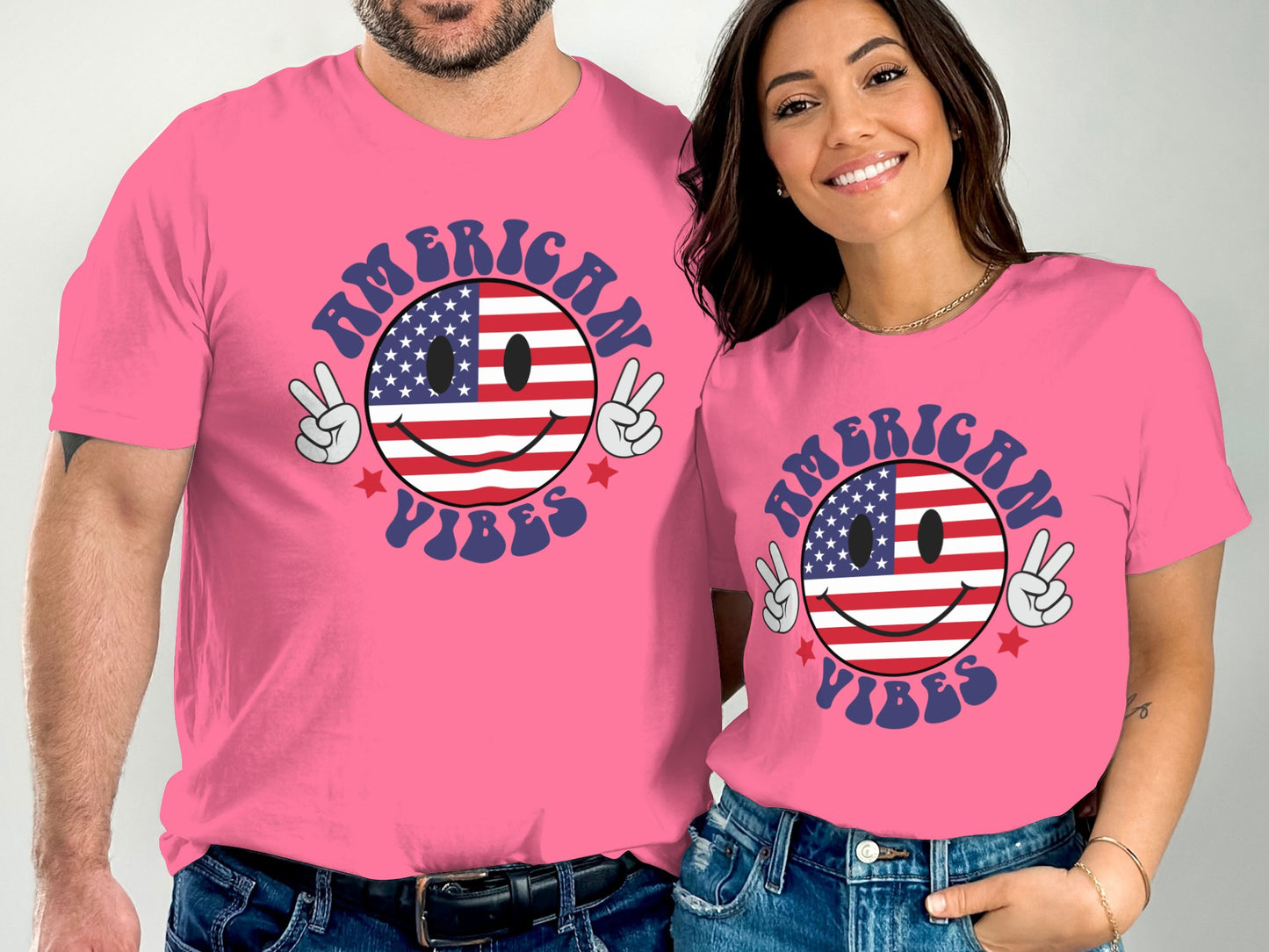 Pink t-shirts with "American Vibes" text and patriotic smiley face graphic.