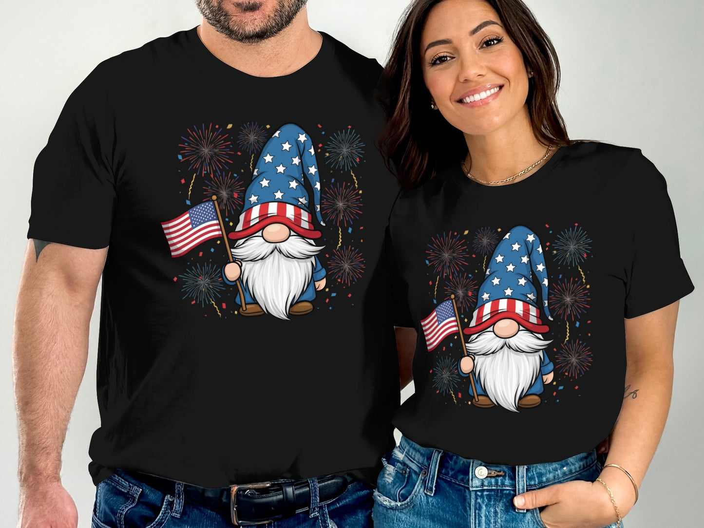 Two people wearing black t-shirts with patriotic gnome designs and American flags.