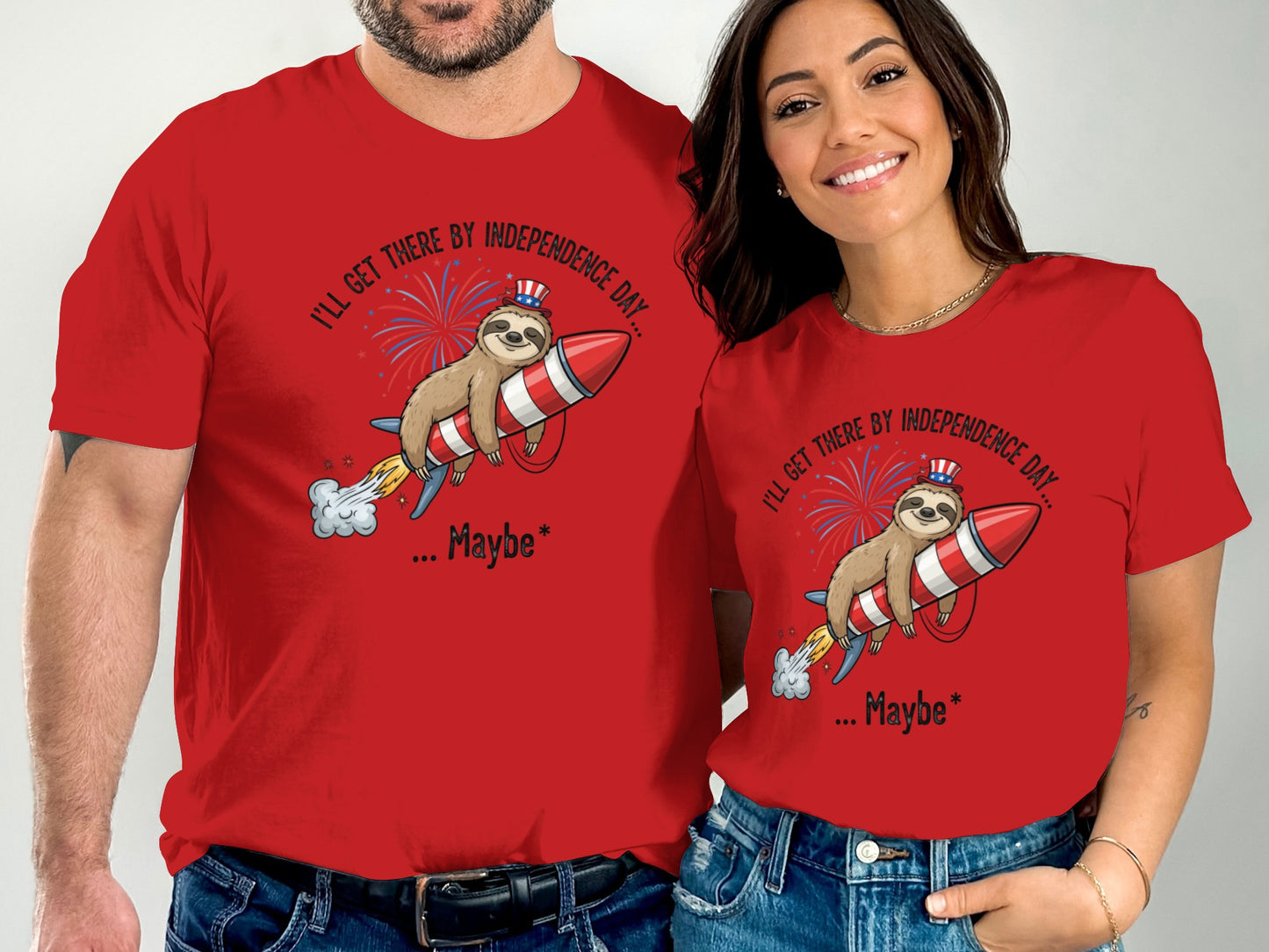 Couple wearing red t-shirts with a sloth riding a rocket for Independence Day.