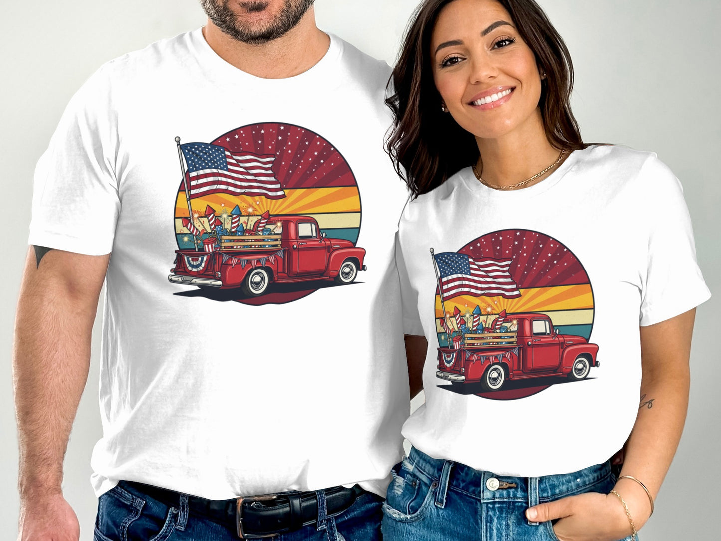 Two people wearing white t-shirts with a red truck and American flag graphic.