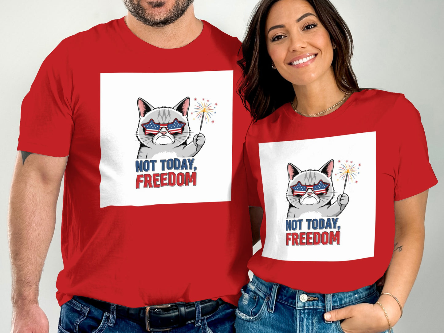 Couple in matching red t-shirts with patriotic cat graphic and "NOT TODAY, FREEDOM" text.