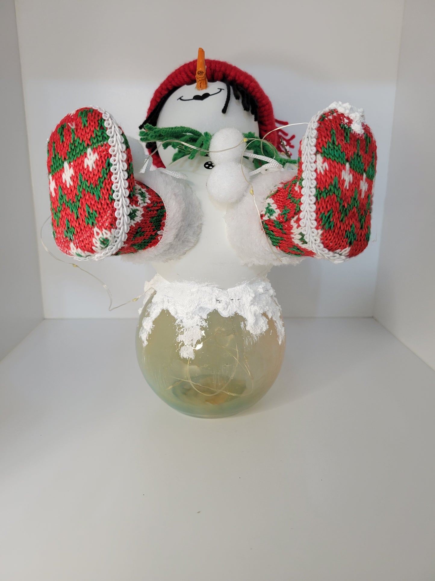 Festive Snowman Decor with Red and Green Knit Accents