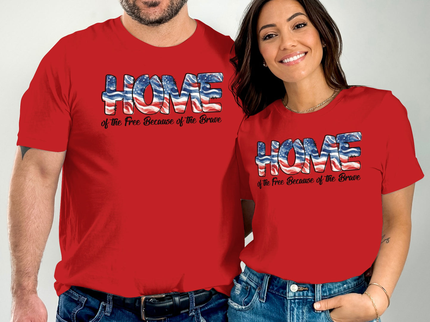 Couple wearing matching red "HOME of the Free Because of the Brave" t-shirts.