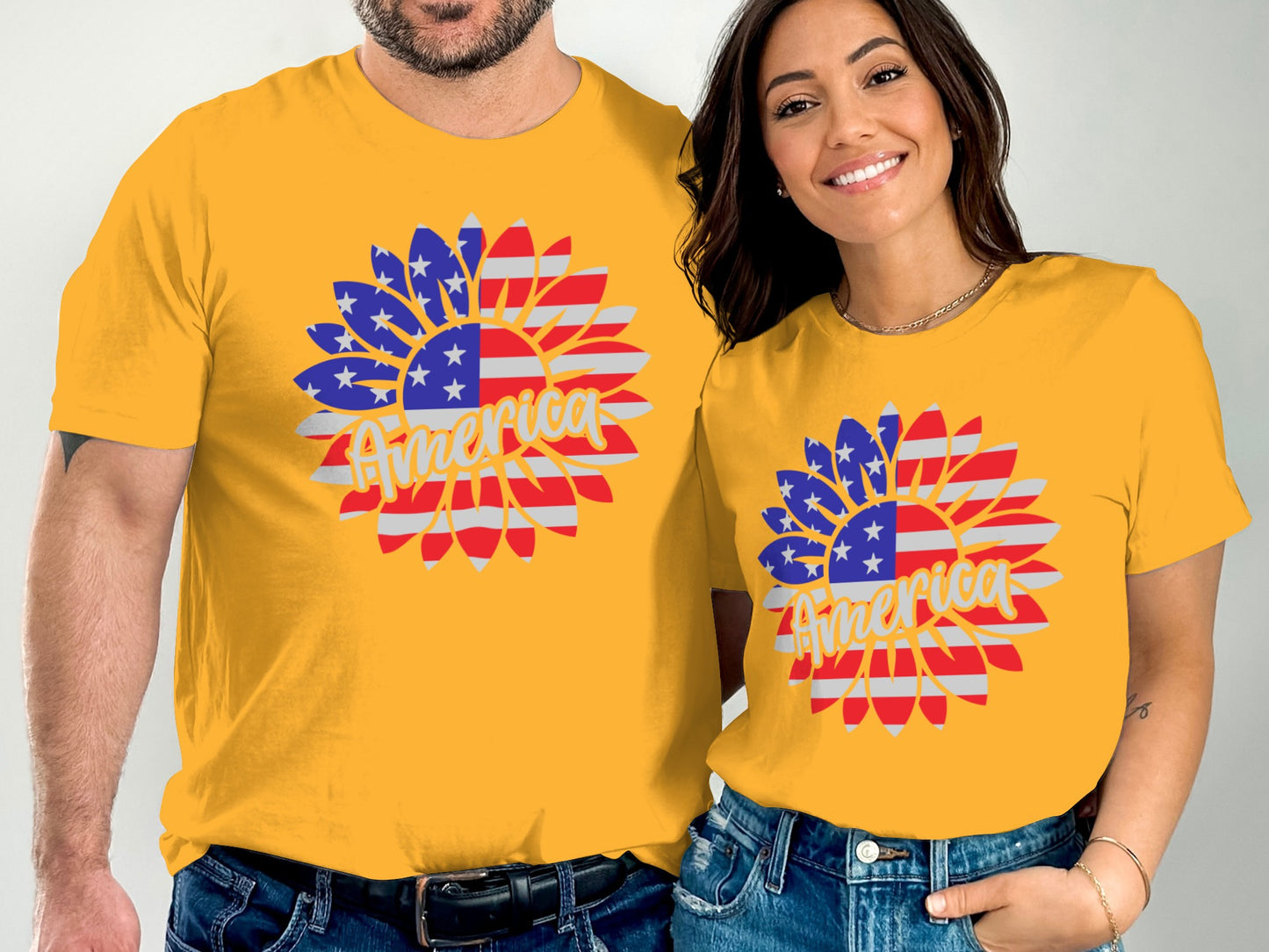 Two people in matching yellow t-shirts with American flag sunflower graphic.