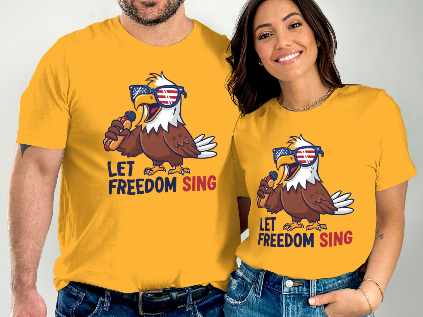 Two people wearing yellow shirts with an eagle singing in sunglasses.