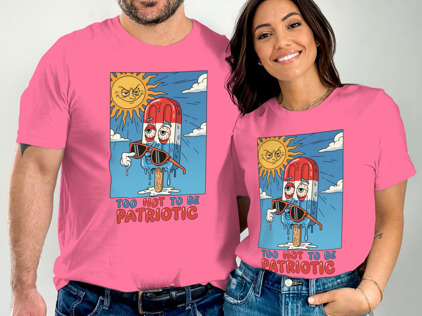 Two people wearing pink t-shirts with a melting popsicle graphic and text.