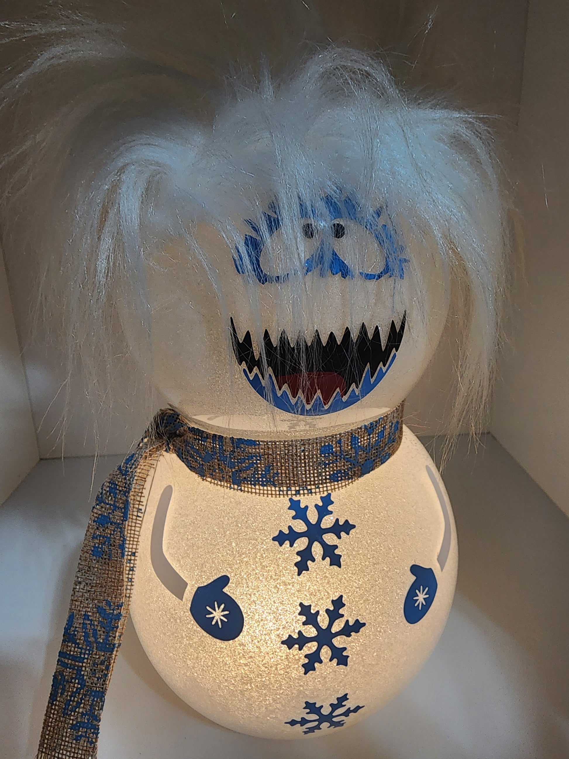 Furry White and Blue Snow Monster with Snowflake Pattern