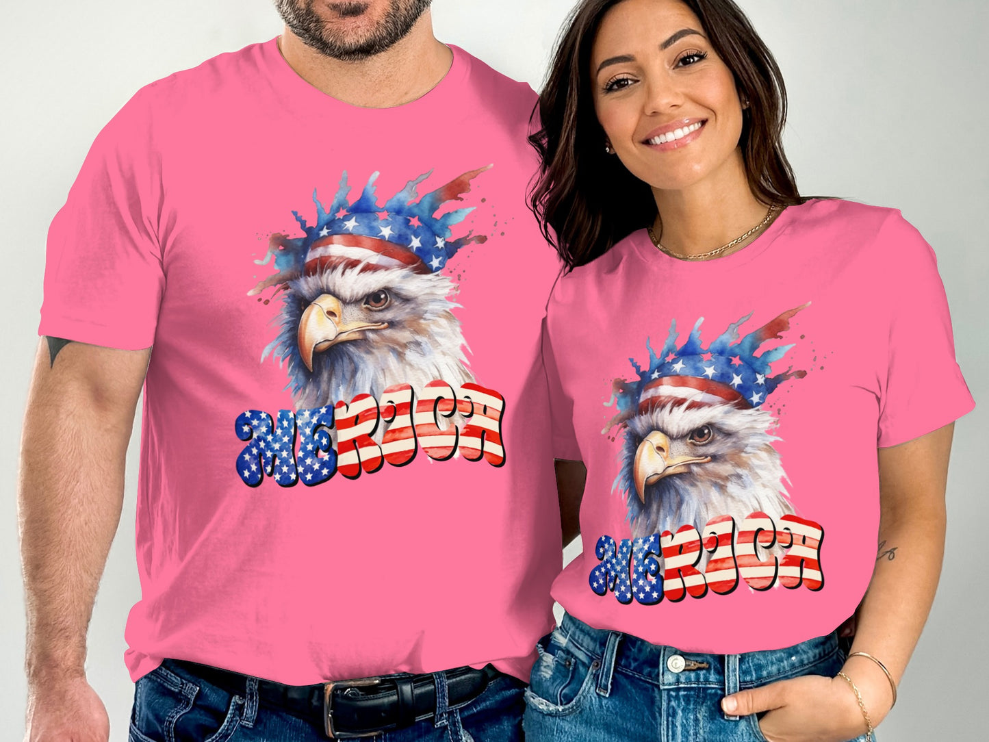 Two people wearing pink t-shirts with an eagle and "AMERICA" design.