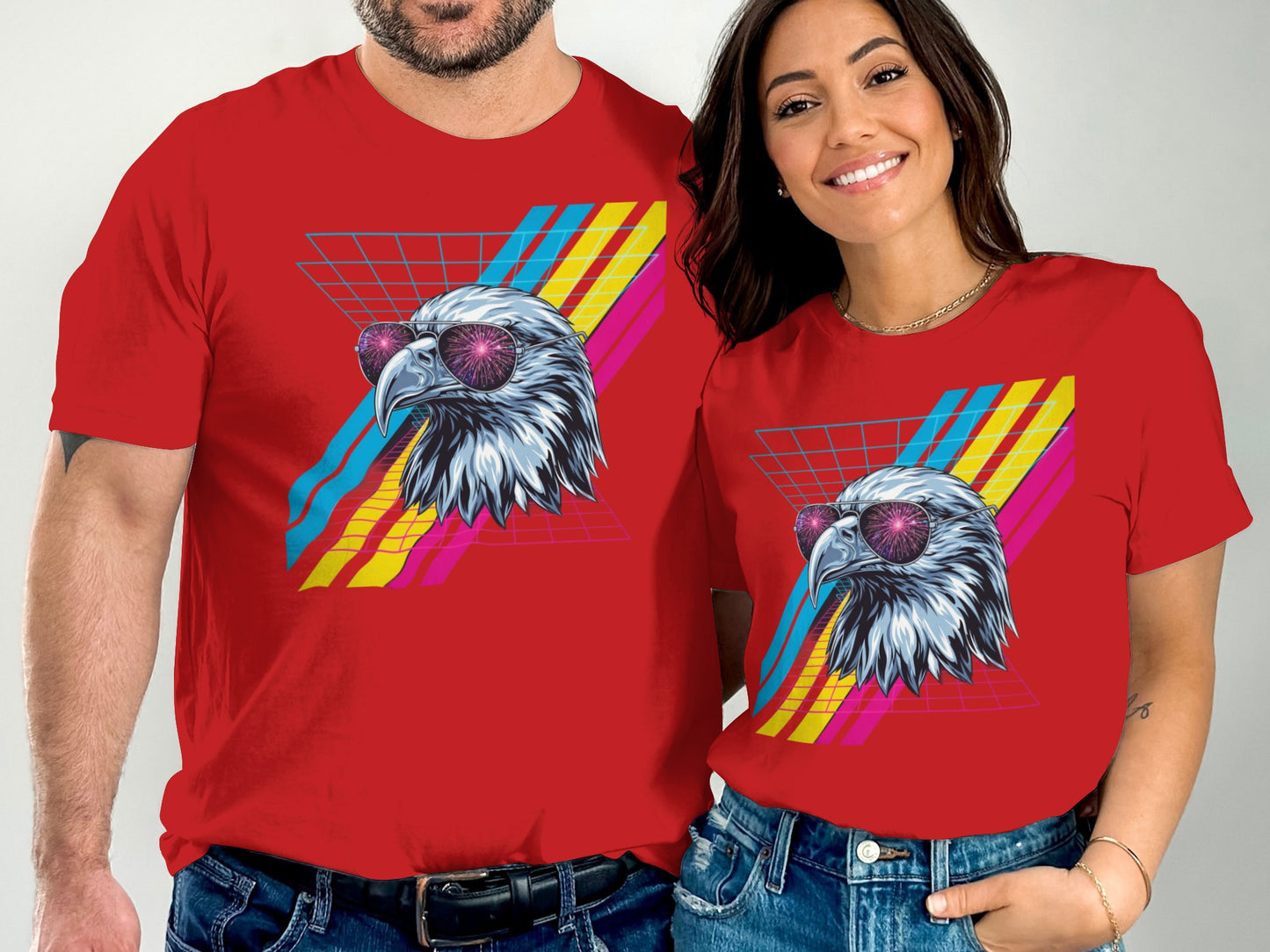 Red t-shirts with retro eagle graphic and geometric grid background.