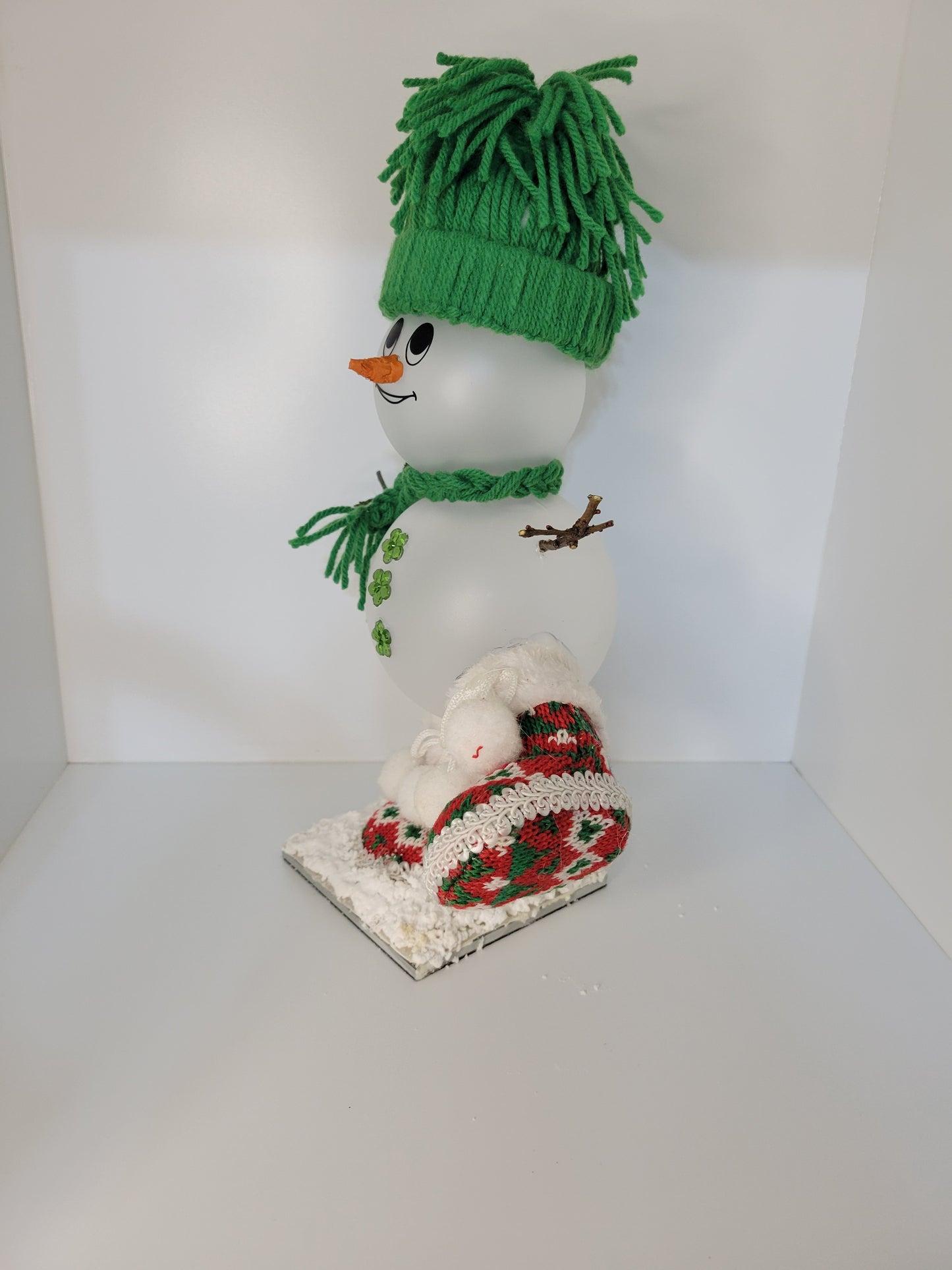 Festive Snowman Decor with Green Hat and Red Booties