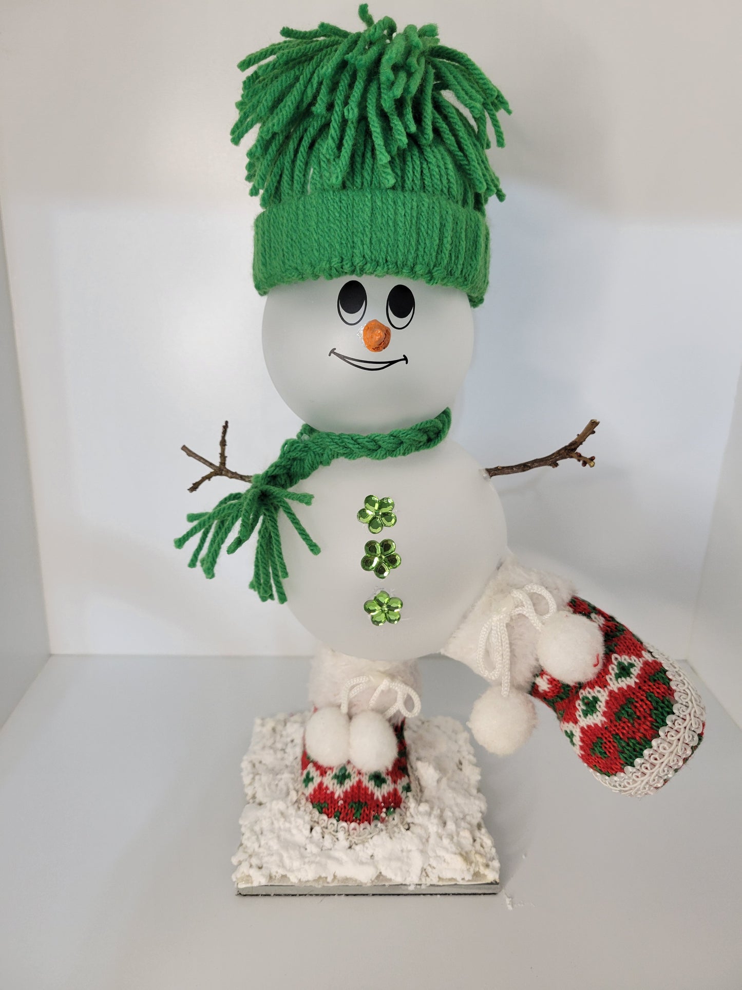 Adorable Winter Snowman with Festive Green Hat Decor