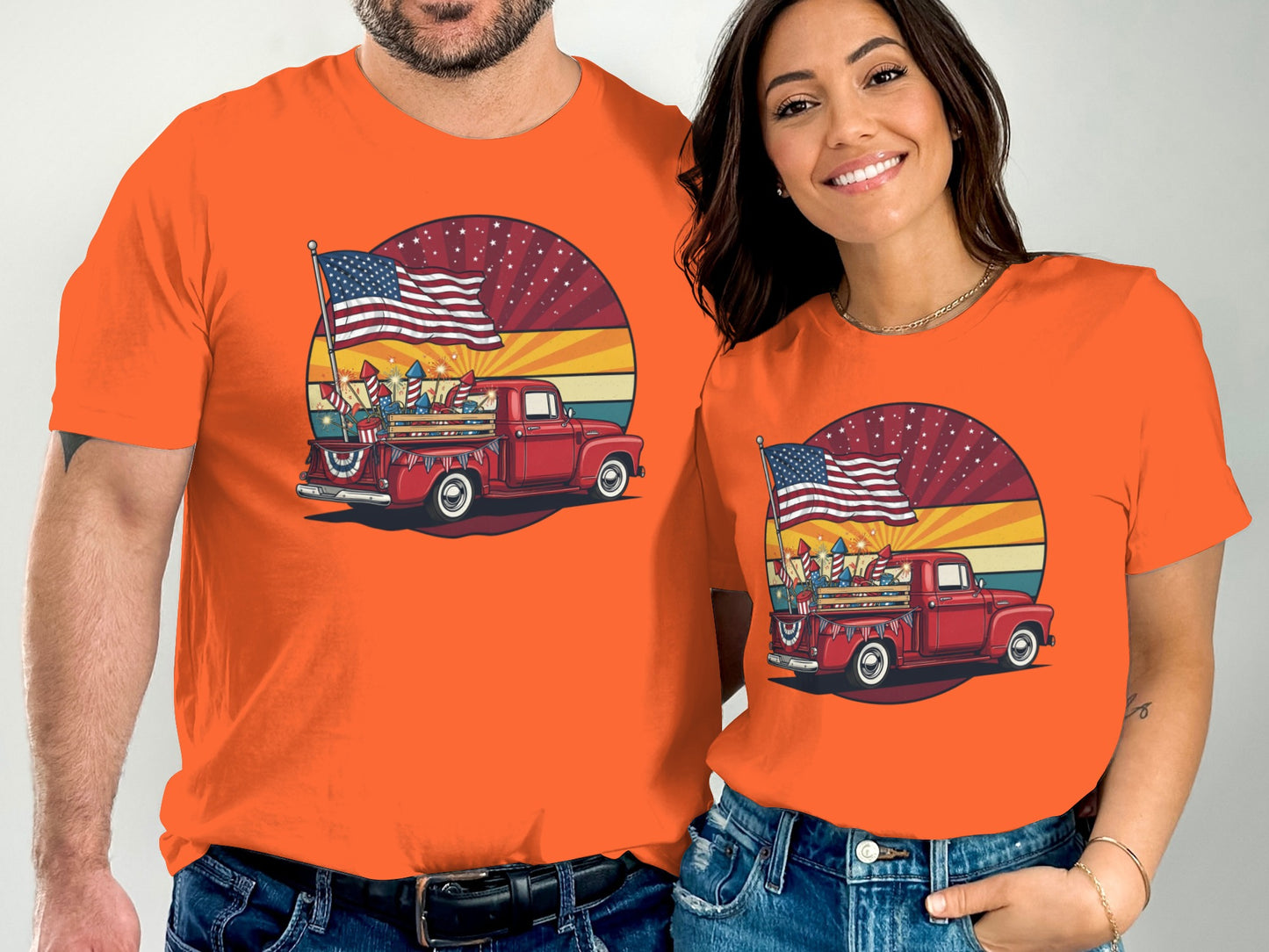 Two people wearing matching t-shirts with a vintage red truck and American flag.