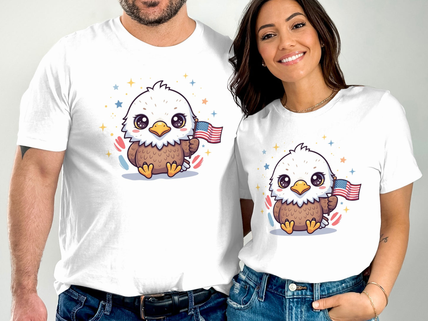 Couple wearing white t-shirts featuring cartoon eagles holding American flags.