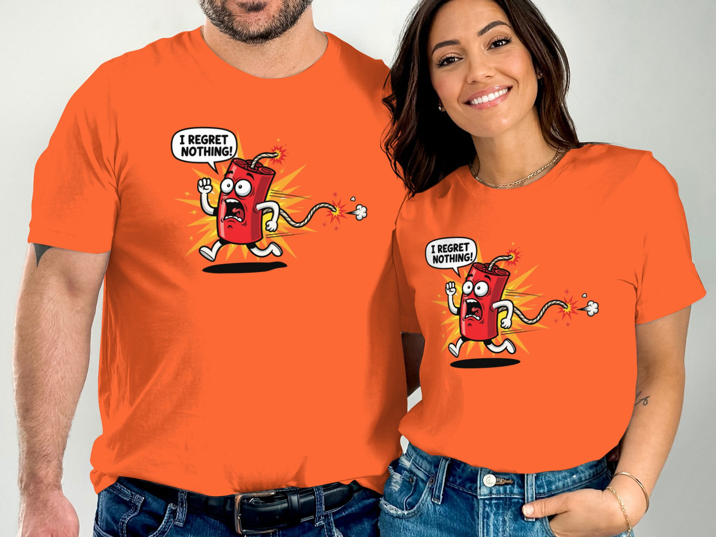 Couple in orange shirts featuring cartoon character with "I regret nothing!" text.