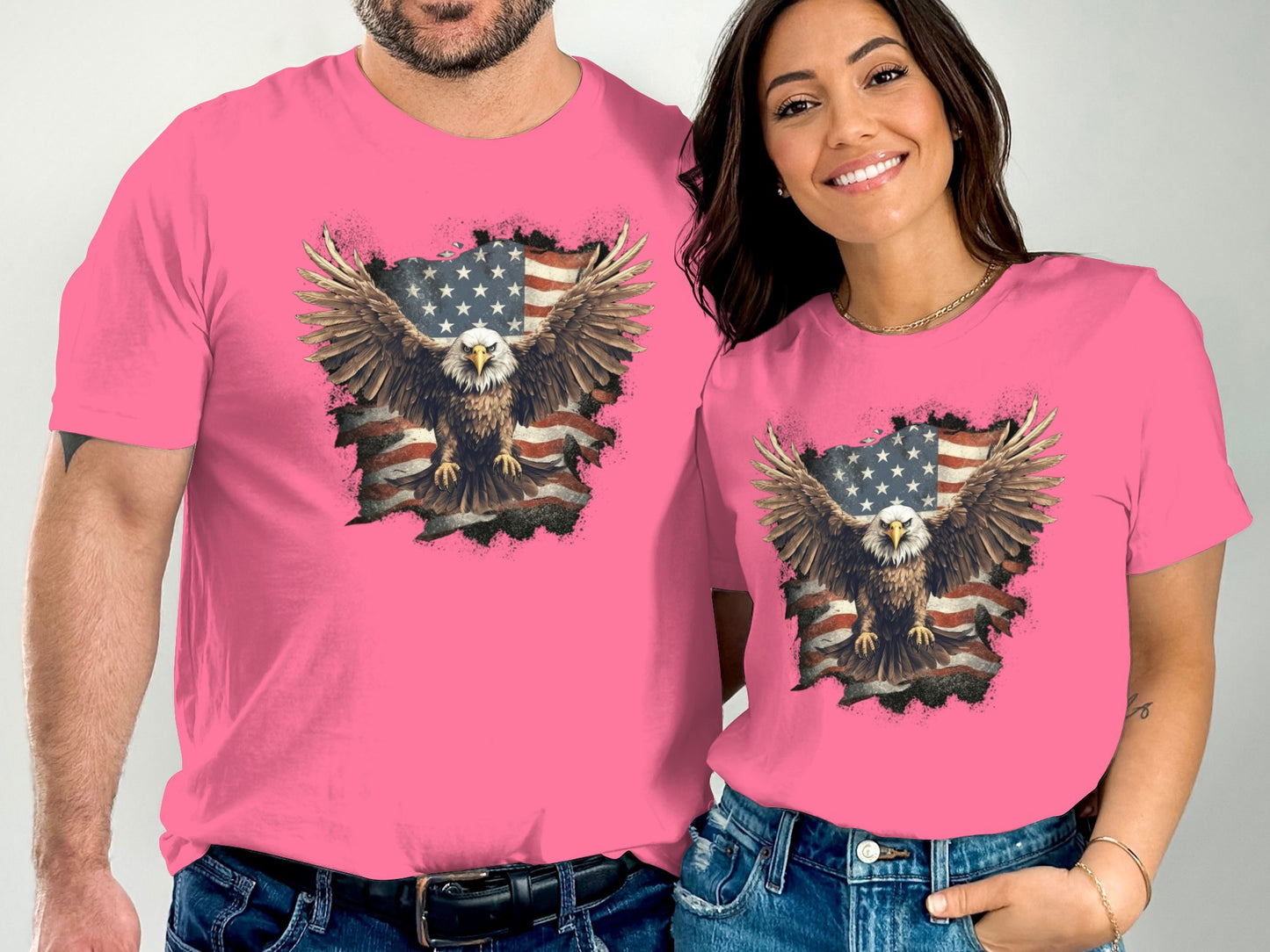 Couple wearing pink t-shirts with distressed American flag and eagle graphic.