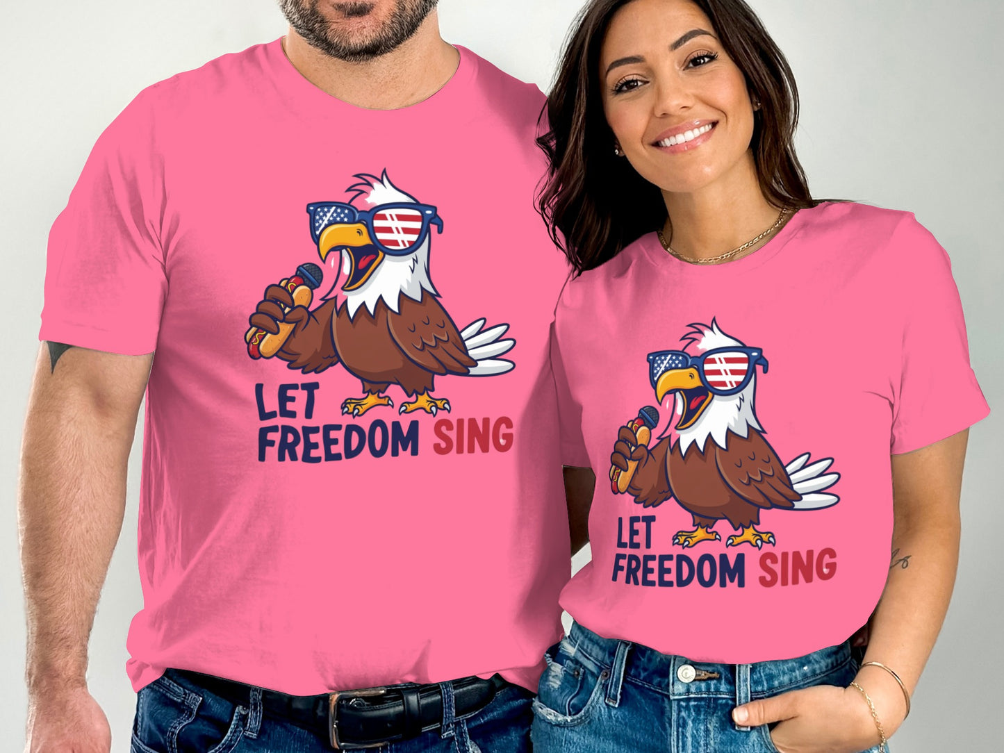 Two people wearing pink t-shirts with an eagle singing with sunglasses.