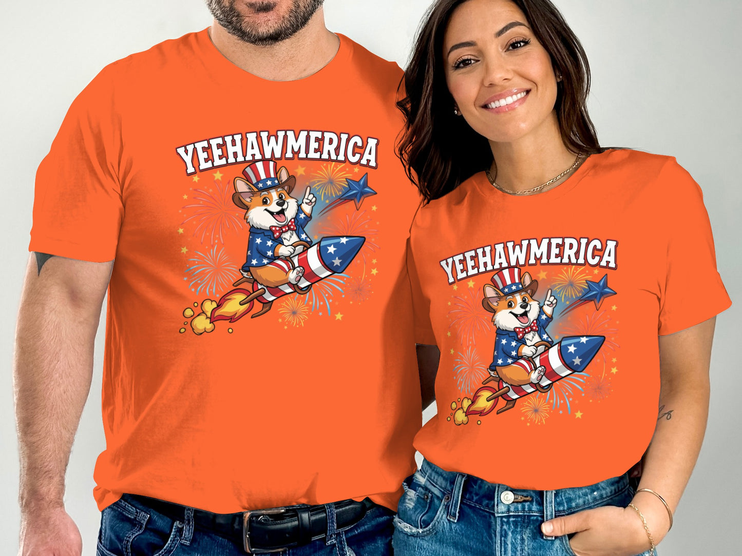 Couple in orange shirts with "Yeehawmerica" design featuring a dog on a rocket.
