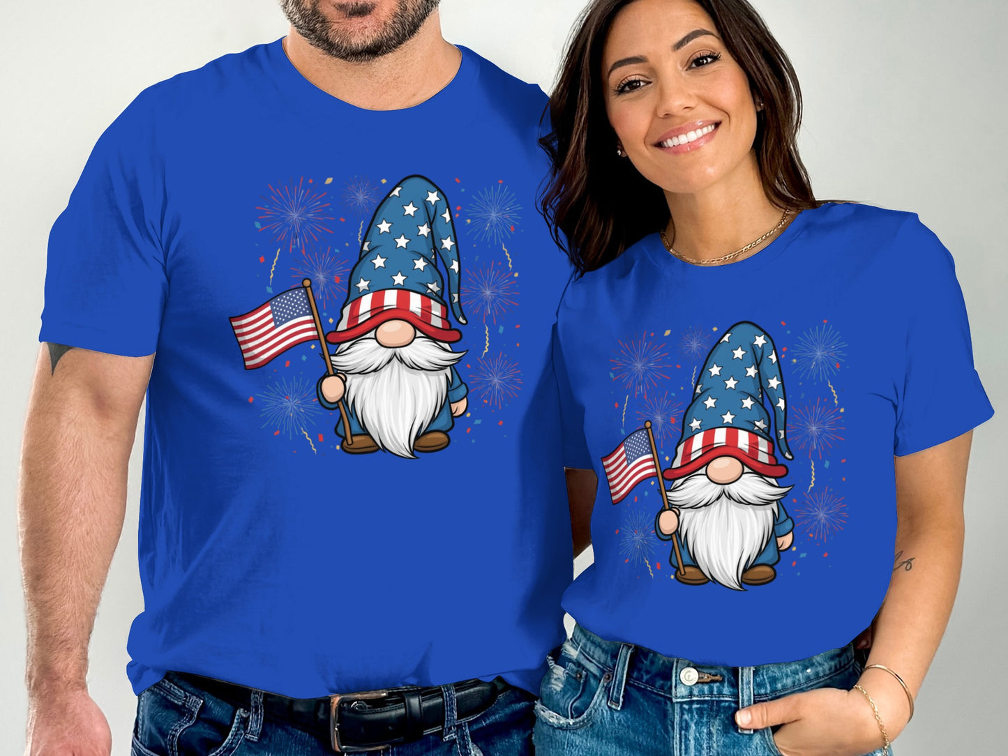 Couple wearing matching blue t-shirts with patriotic gnome design.