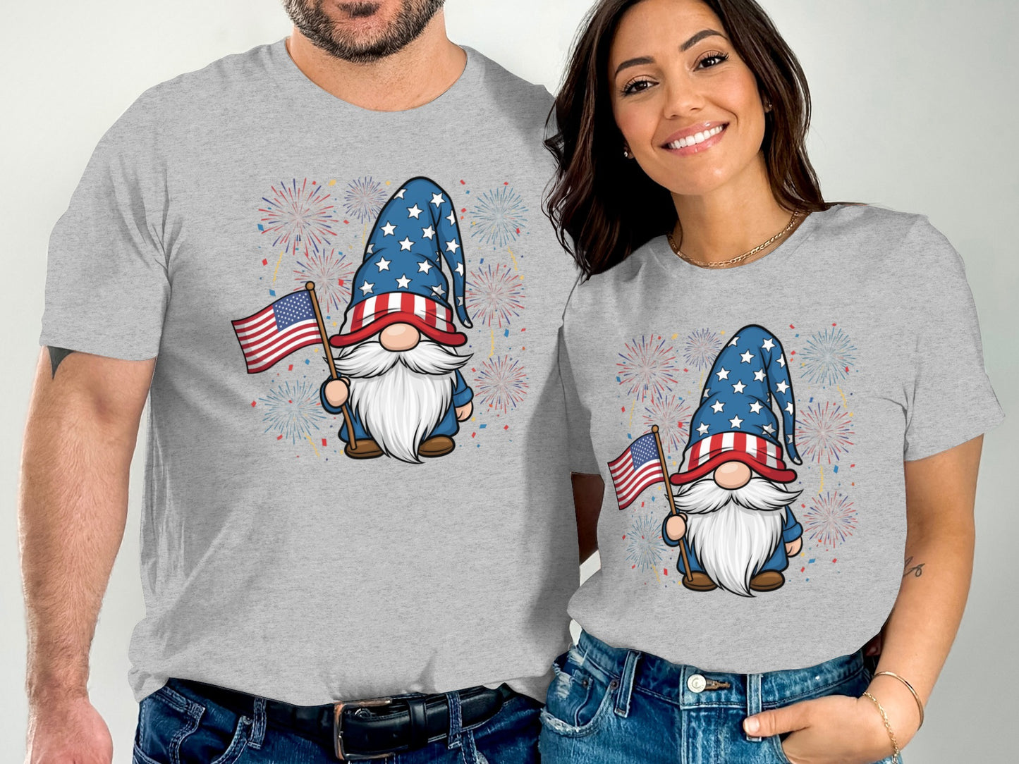 Couple wearing matching gray t-shirts with a patriotic gnome graphic.