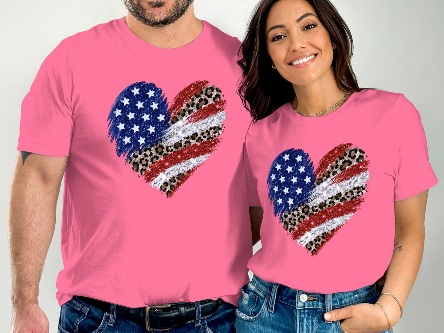 Two people wearing matching pink t-shirts with a distressed American flag heart design.