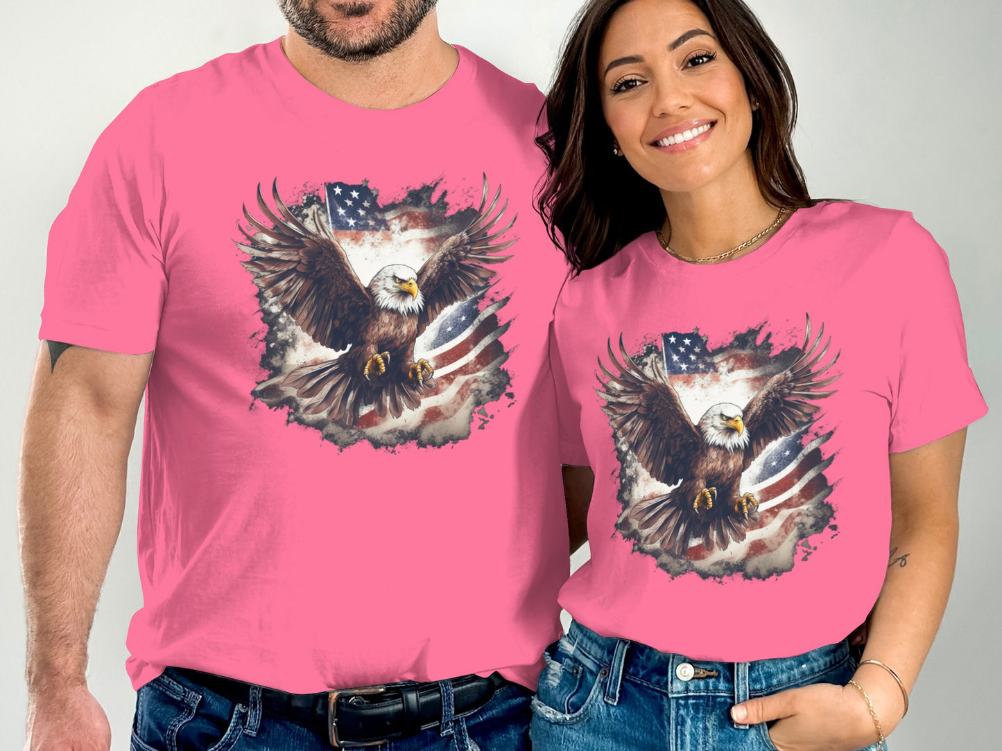 Eagle on American flag graphic on pink t-shirts worn by a man and woman.