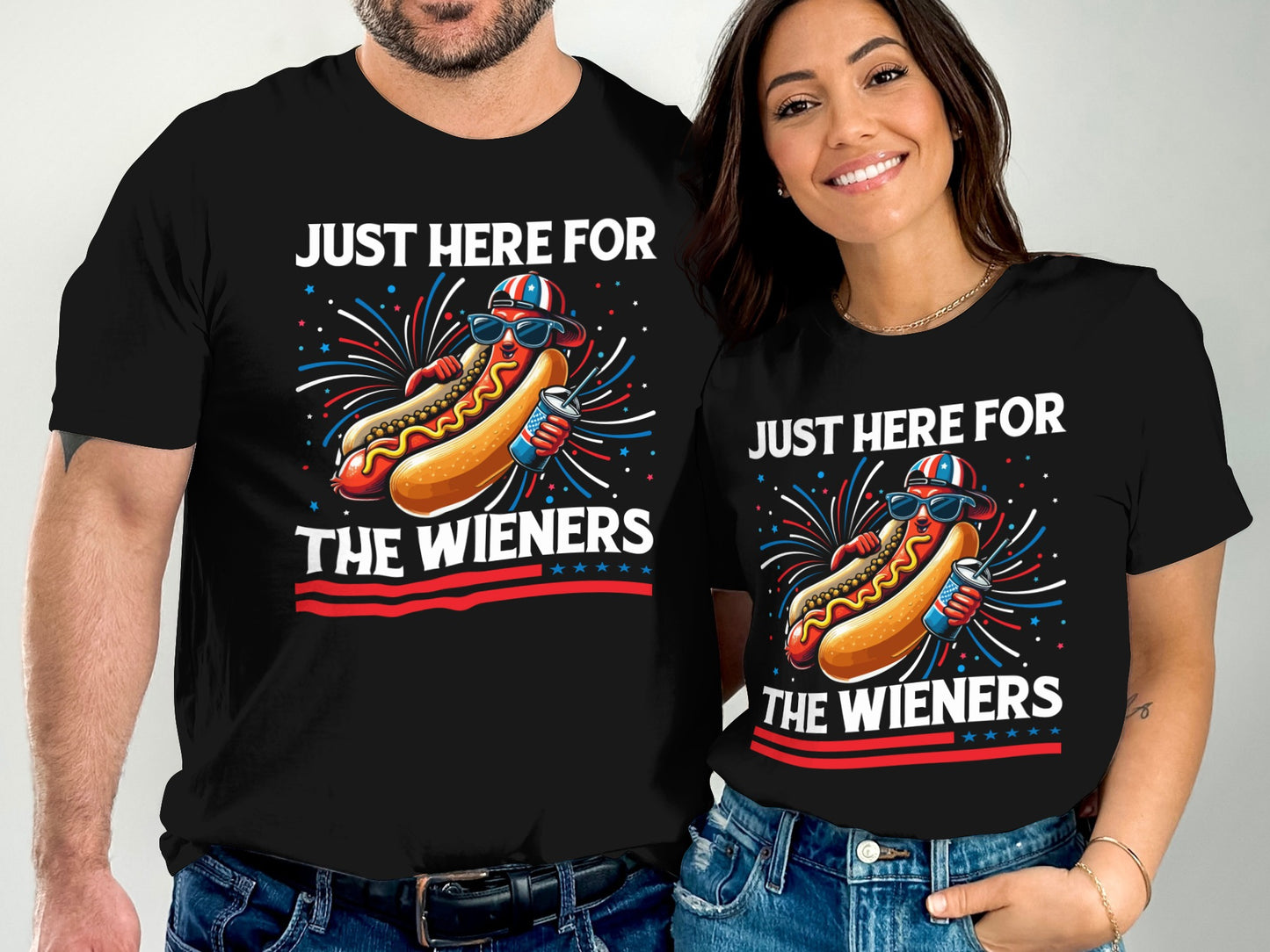 Couple wearing matching black t-shirts with hot dog design and text.