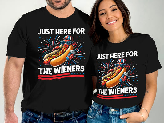 Couple wearing matching black t-shirts with hot dog design and text.