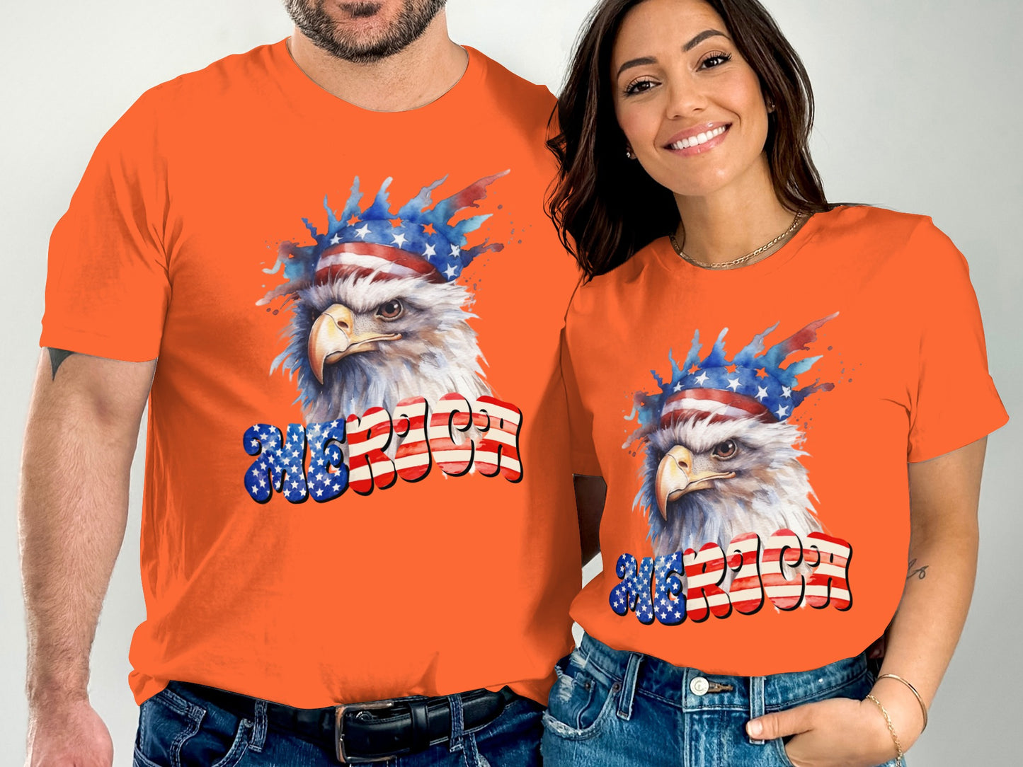 Two people wearing orange t-shirts with an eagle wearing a patriotic headband and "USA" text.