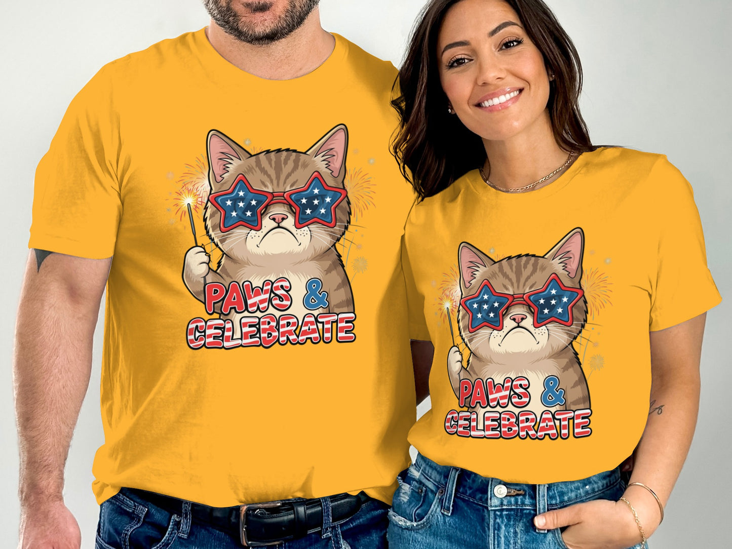 Couple in yellow t-shirts with patriotic cat graphic and "Paws & Celebrate" text.