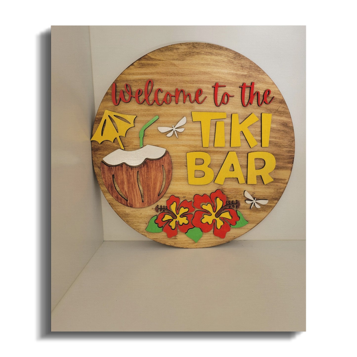 Welcome to the Tiki Bar sign with flowers decoration