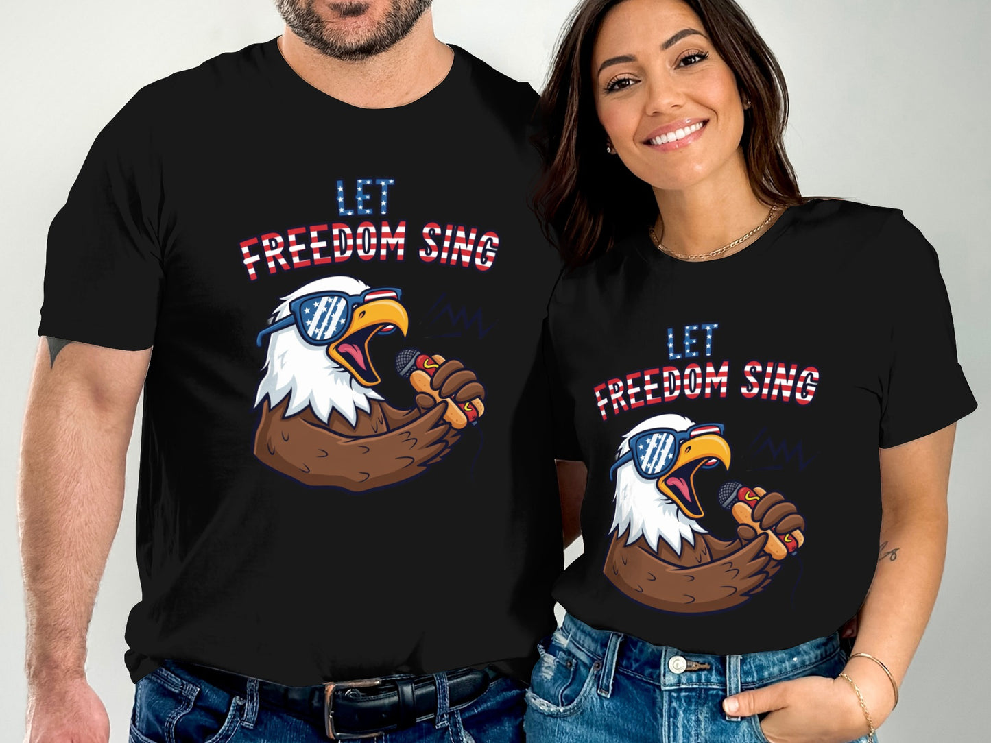 Couple wearing matching t-shirts with an eagle singing the anthem.