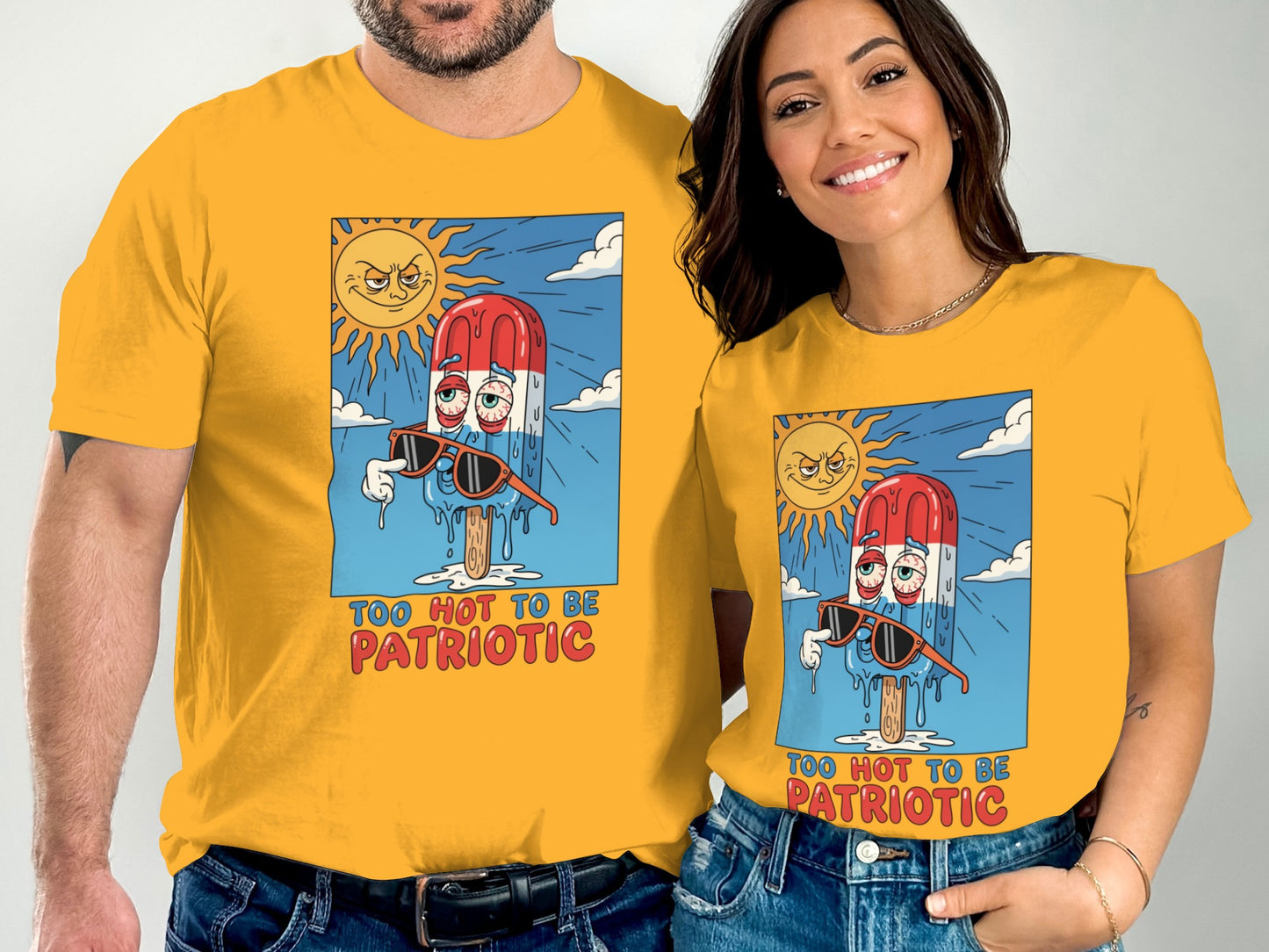 Couple wearing matching yellow t-shirts with "Too Hot to Be Patriotic" popsicle graphic.