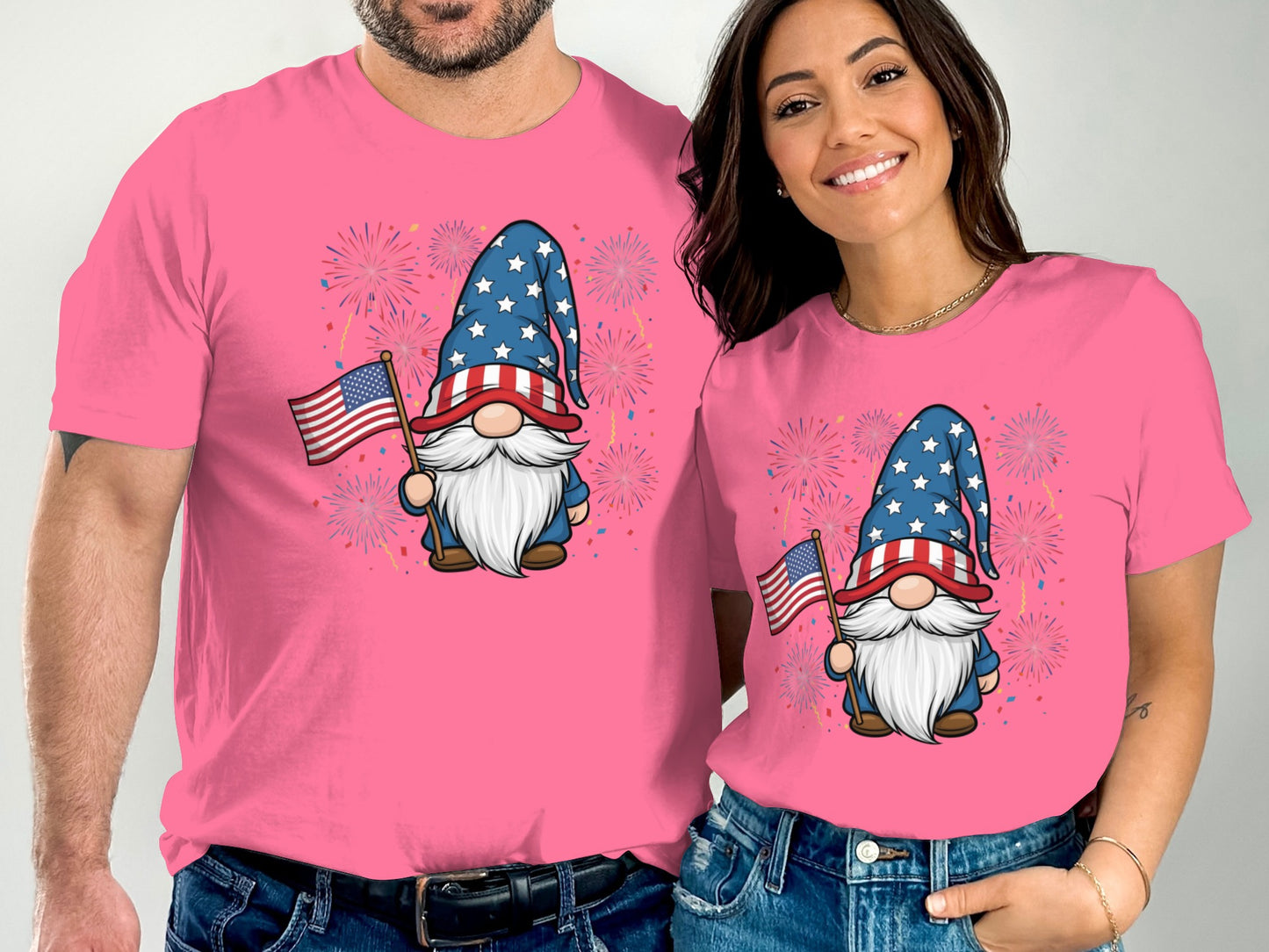 Gnome graphic with American flag and fireworks on pink t-shirts.