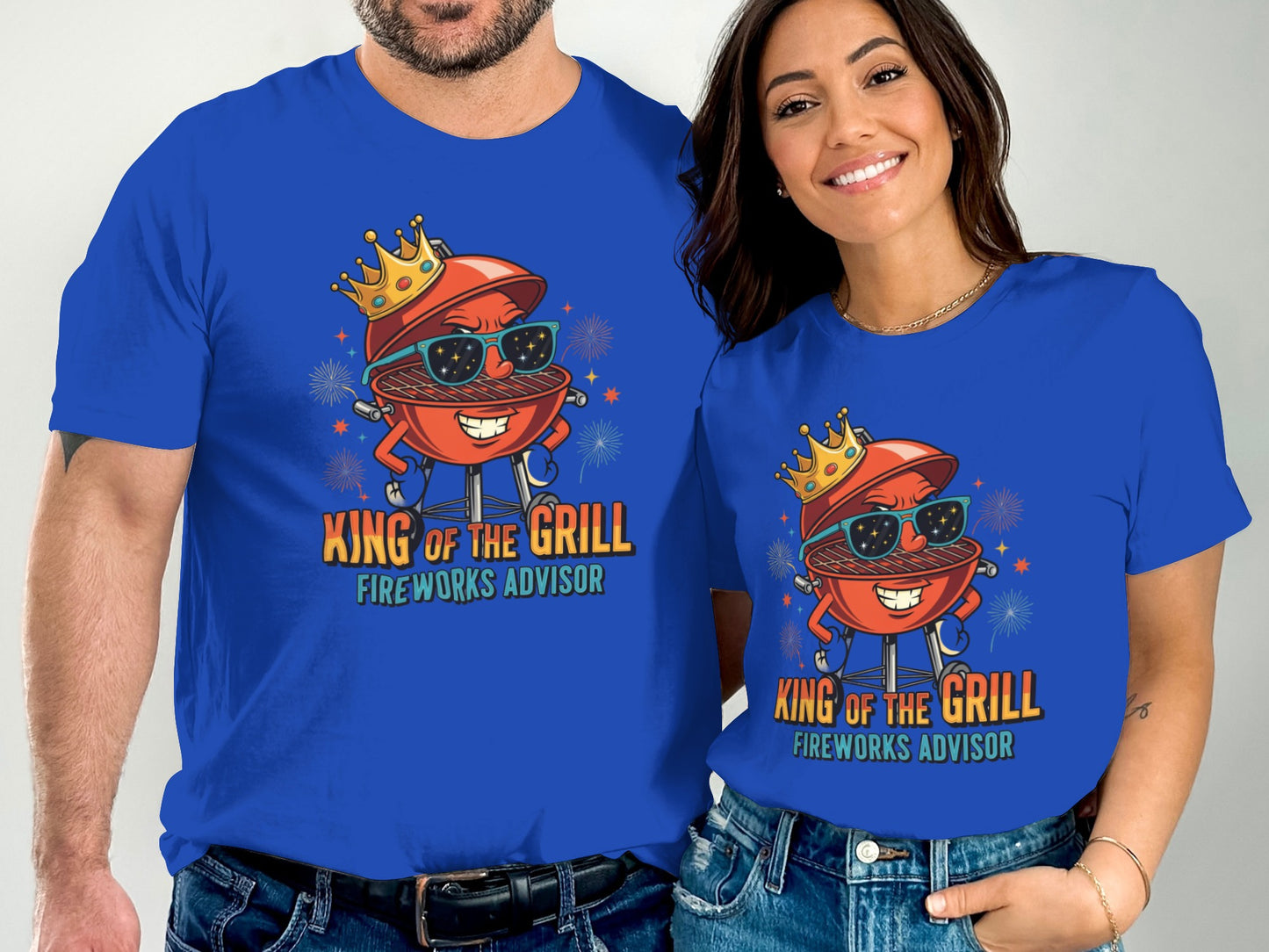 Couple wearing matching King of the Grill fireworks advisor t-shirts.