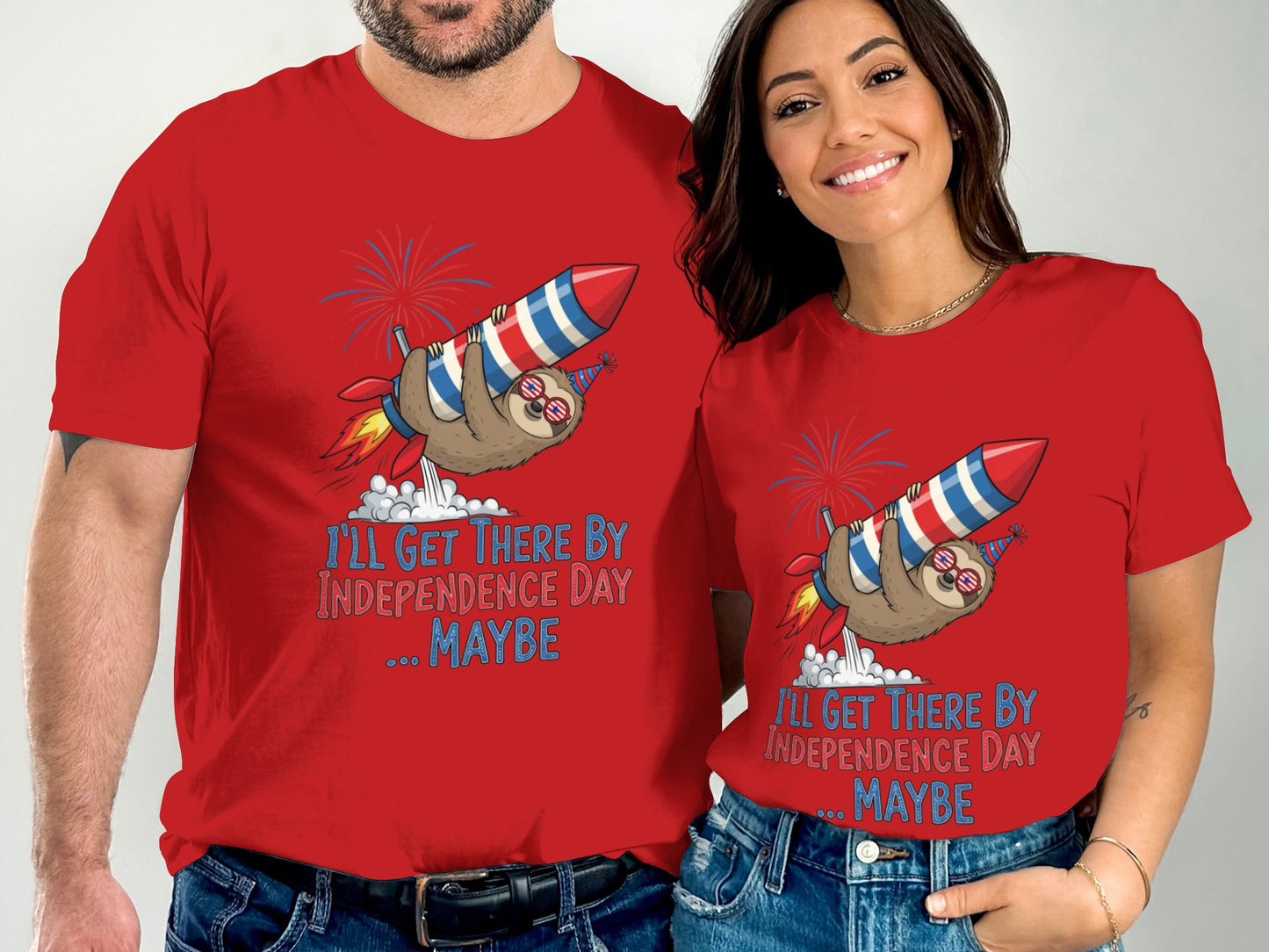 Red t-shirts with a sloth riding a rocket and "I'll get there by Independence Day... maybe" text.