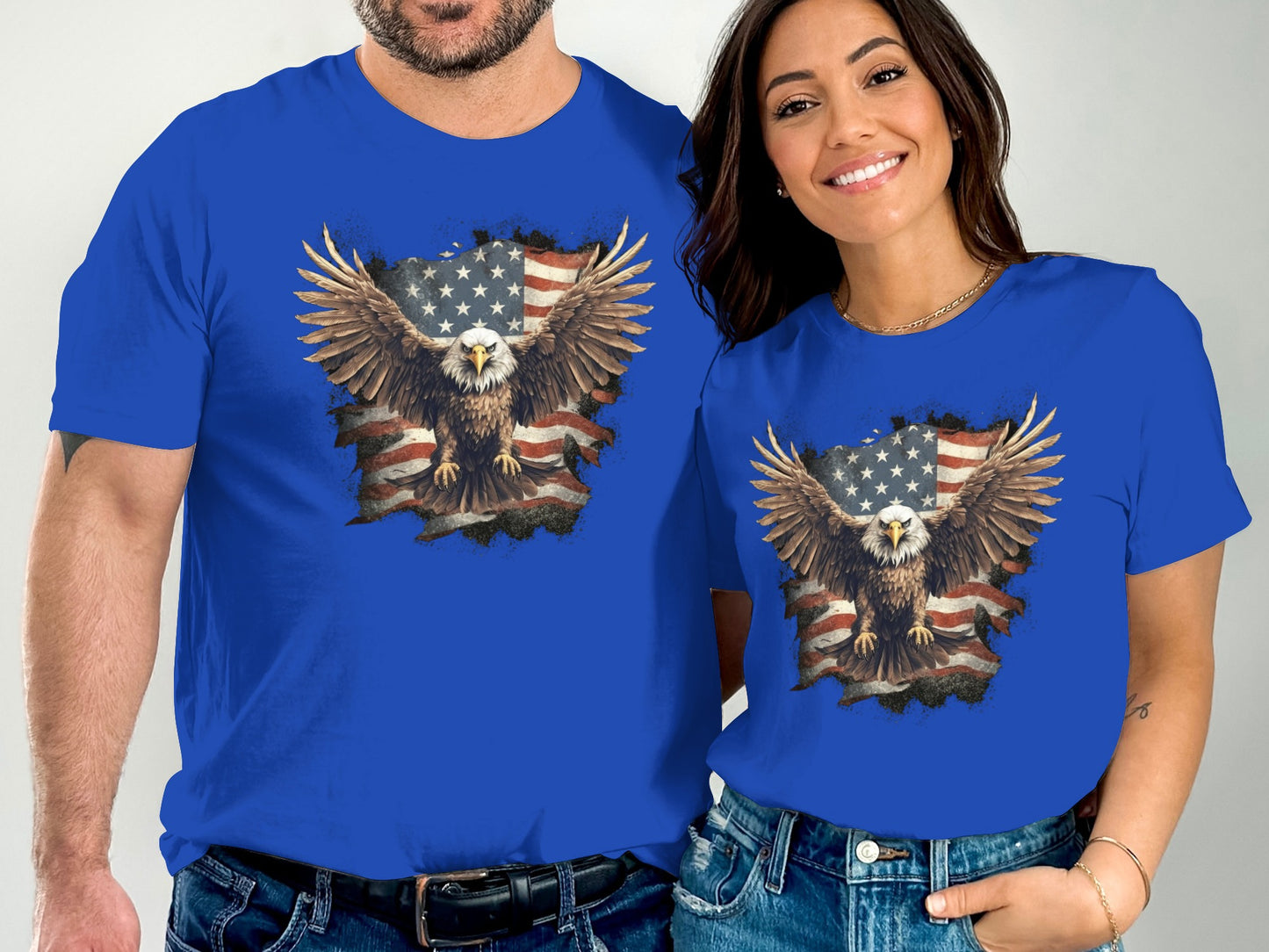 Man and woman wearing blue t-shirts with distressed eagle graphic.