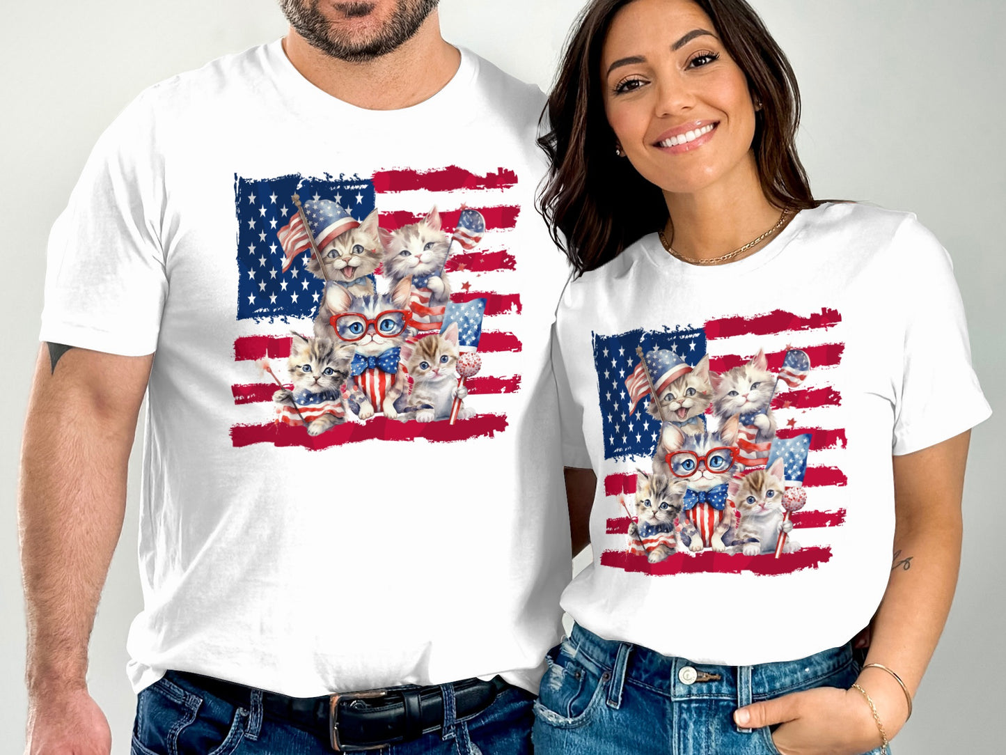 Two white t-shirts featuring American flag themed cats.