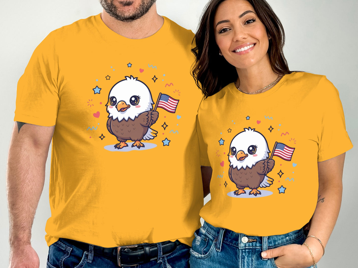 Couple wearing yellow t-shirts featuring a cartoon eagle holding American flags.