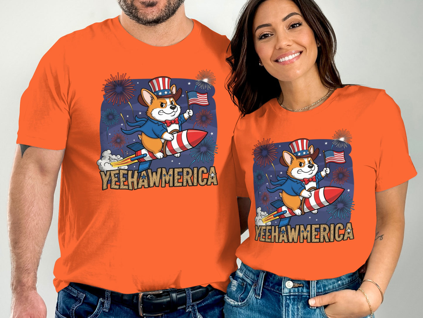 Couple wearing matching orange shirts with patriotic corgi on rocket graphic.