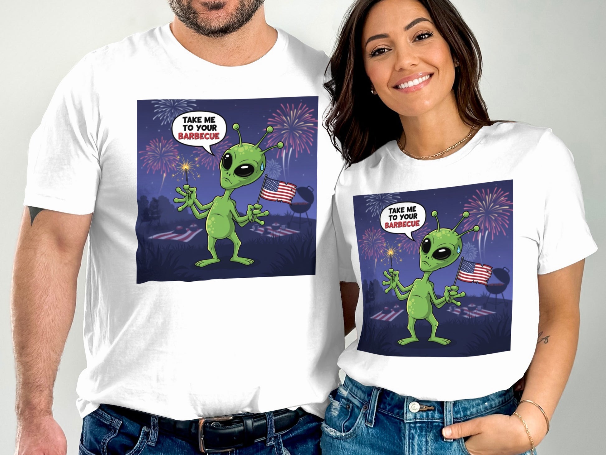 White t-shirts with aliens at a barbecue with fireworks and American flags.
