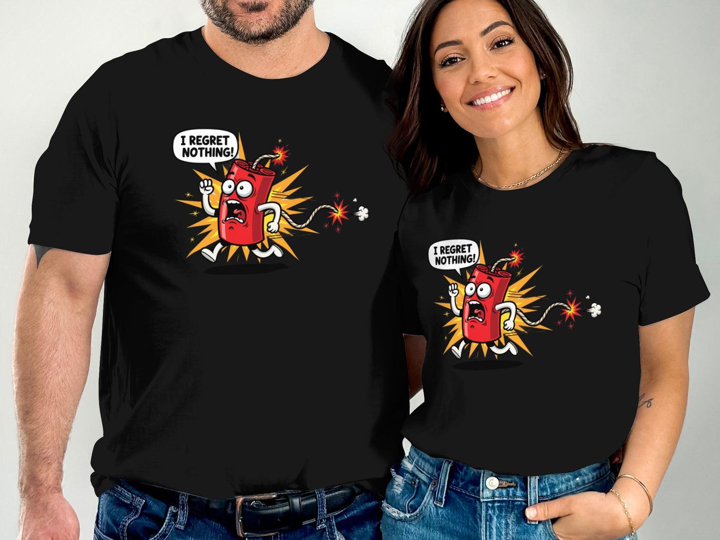 Couple in black t-shirts with cartoon dynamite character saying "I regret nothing!".