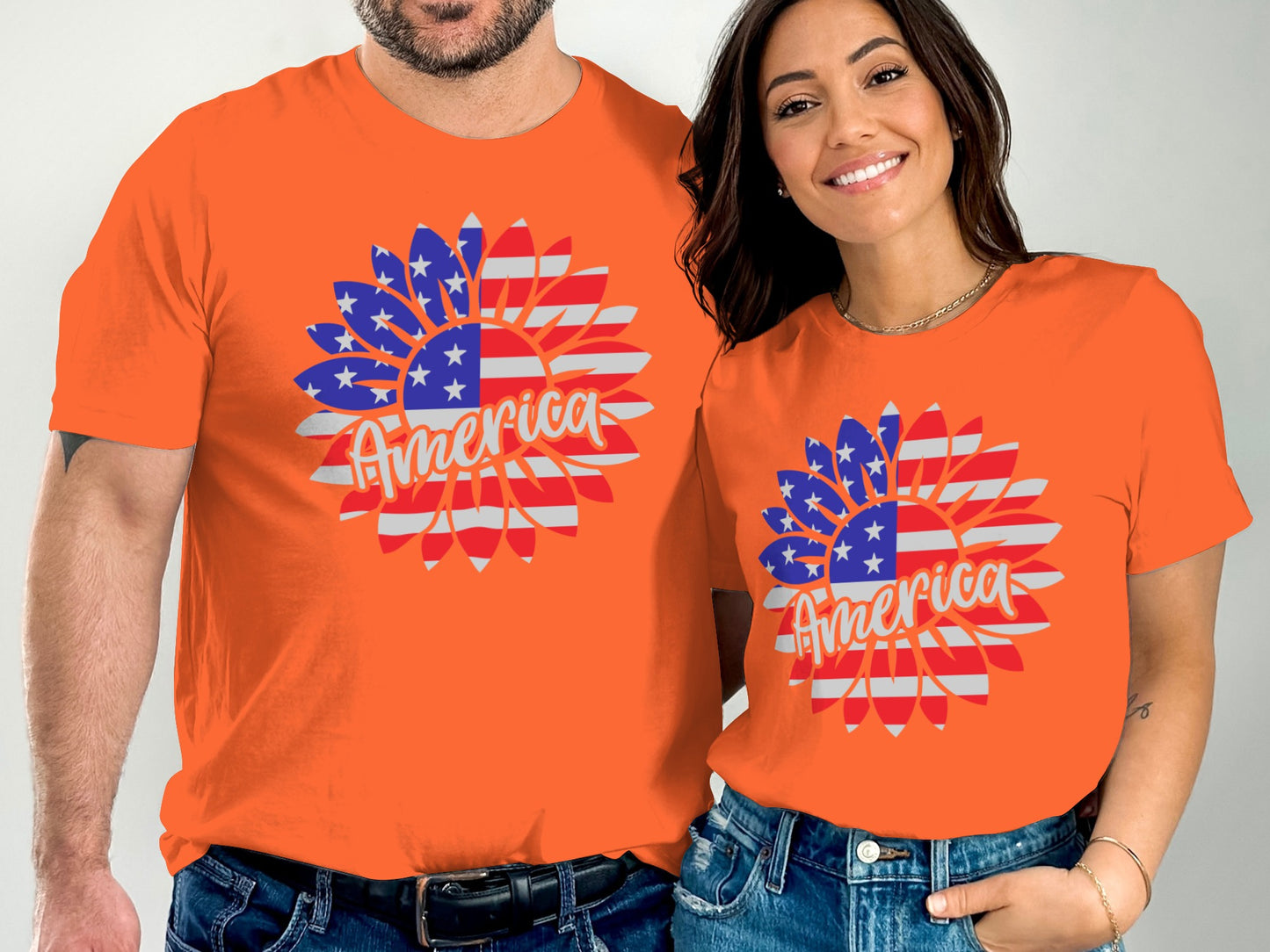 Two people wear orange t-shirts with American flag sunflower designs.