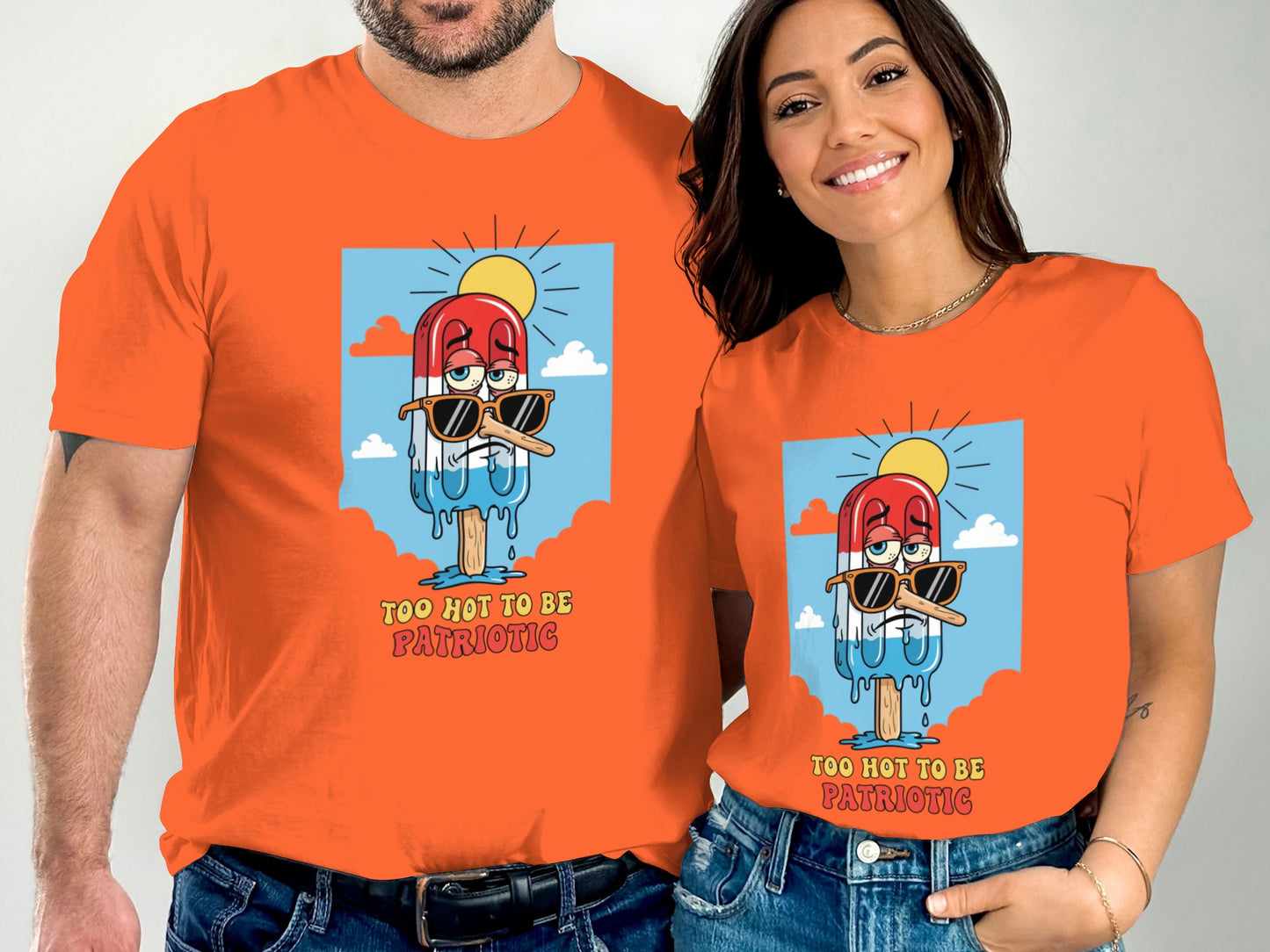 Orange t-shirts with a cartoon popsicle wearing sunglasses and the text "TOO HOT TO BE PATRIOTIC".